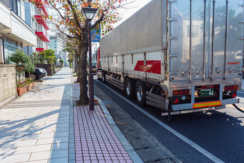 Of course I am back in Japan yet again - Oct and Nov 2018 - Work time! Notice these trucks have skirts / rails along the side between the wheels and even hanging from the back to stop people / bikes etc going u