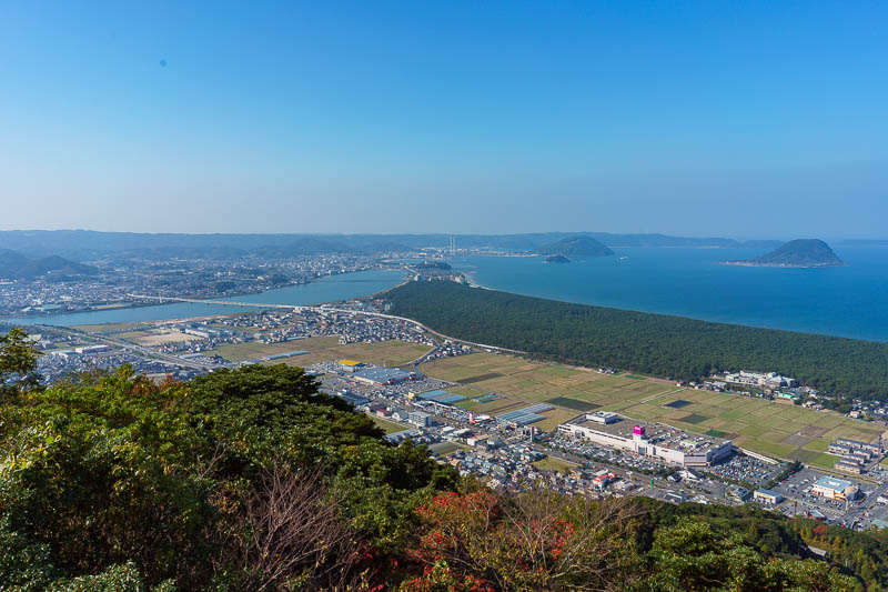 Japan-Karatsu-Castle-Hiking - Here you can see half the coastal pine forest, extending up the ISTHUMUS and over the bridge to the castle with the chimneys in the distance, basicall