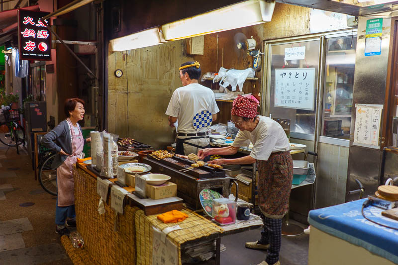 Japan-Tokyo-Asakusa - This old lady lost all her money on bitcoin so now she has to grill mystery meat on sticks in the middle of the night and sell them to passing strange