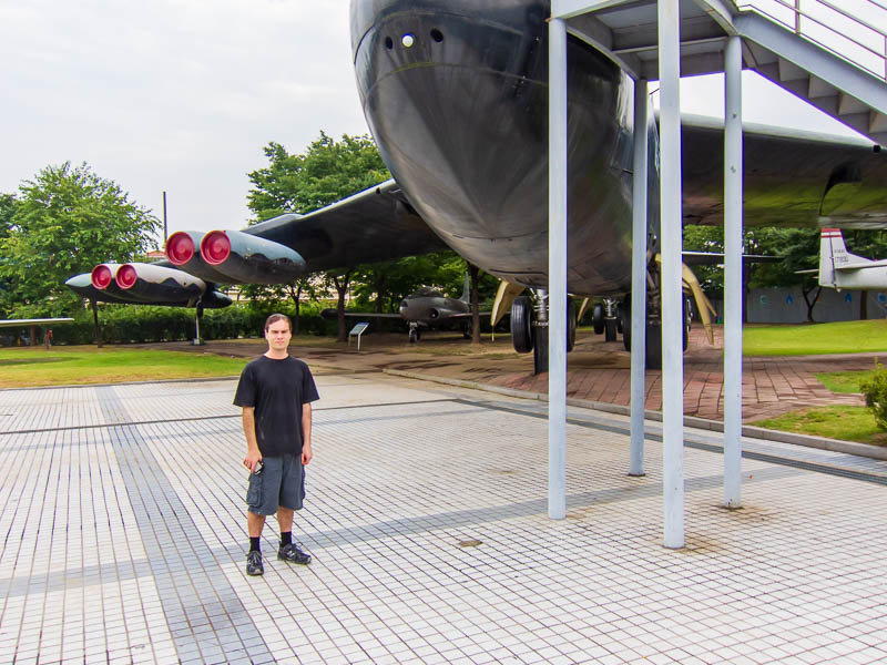 Korea and Hong Kong - September 2011 - Me, standing in front of a B52. Whilst they arent as big as I imagined, I still cant figure out how they got it here. Surely they had to cut the wings