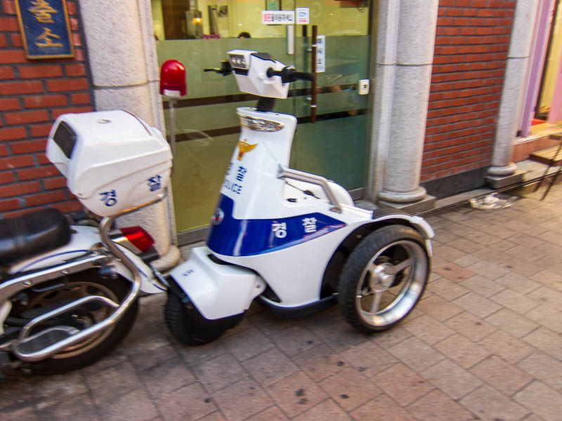 Korea-Seoul-Dongdaemun-Bibimbap - Seouls finest, to protect and to serve, on 3 wheeled idiot scooters. 