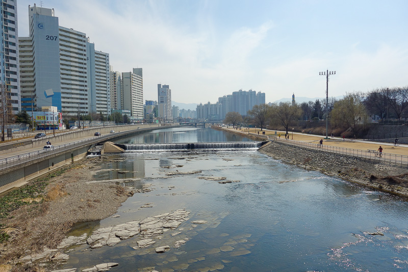 Korea-Incheon-Seoul-Daegu-Bullet Train - A river running through Daegu. Very clean. Quite a few people exercising. This is a quiet part of town though, where I am staying is chaotic closed of