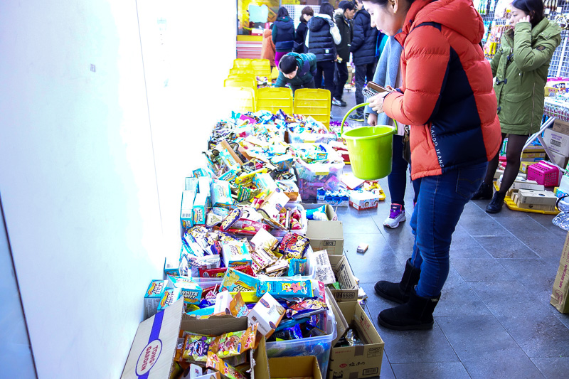 Korea again - Incheon - Daegu - Busan - Gwangju - Seoul - 2015 - This is a korean junk candy shop. Grab a bucket, fill it with the boxes of chocolate and whatever piled on the floor, then weigh your bucket. I filled