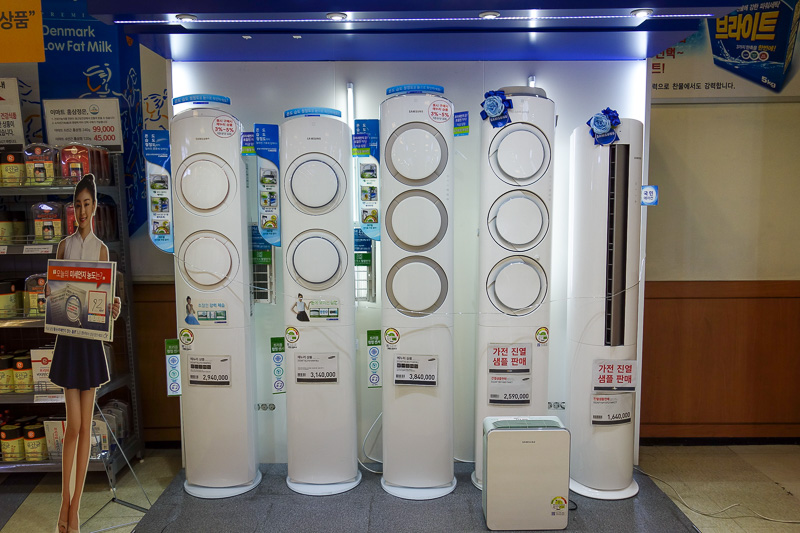 Korea-Gwangju-Rain-Uprising - It started raining so I went to another store. These are air purifiers. They are 6 feet tall and cost $3500 AUD. Cool.