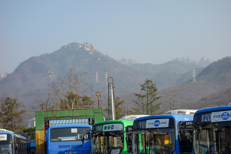 Korea-Seoul-Hiking-Bukhansan-Baegundae - I think the highest peak is in the centre here, behind the one in the foreground. Nice yellow sand. If you take public transport, its on foot from her