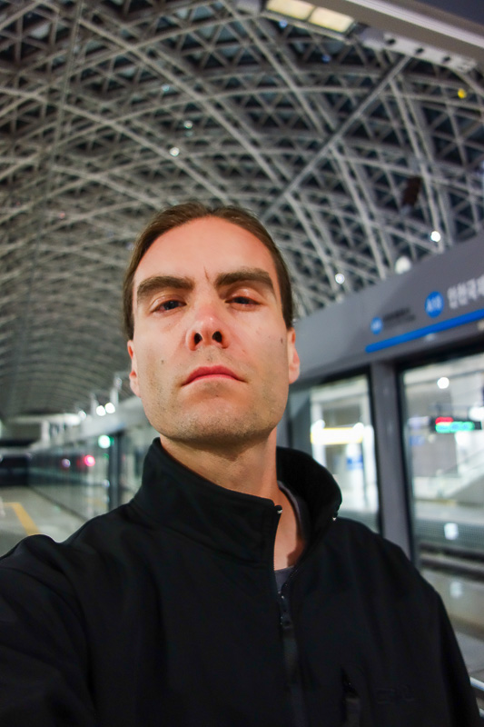 Korea again - Incheon - Daegu - Busan - Gwangju - Seoul - 2015 - Its me, waiting for the airport train, looking pleased. Apparently they are building a maglev that goes around in a bullshit circle for tourists to go