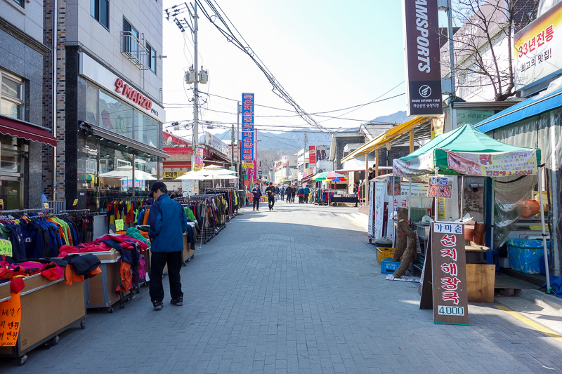 Korea again - Incheon - Daegu - Busan - Gwangju - Seoul - 2015 - This is the low rent part of the hiking village, nearer the subway. Right by the gate are huge brand name stores, like the north face, columbia, patag