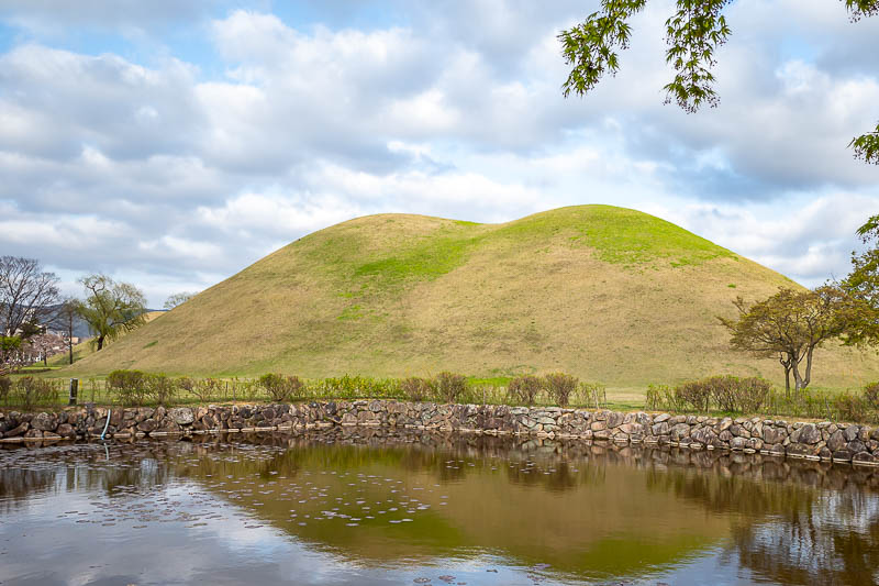 Korea-Gyeongju-Hwangnidan - Let's start with some tomb mounds. Here are some mounds with a pond.