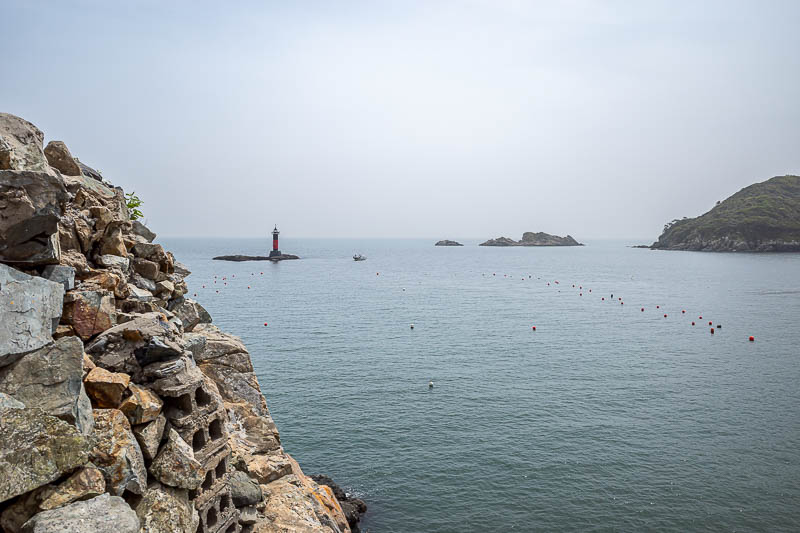 Korea-Busan-Beach-Dadaepo - There are a few tiny lighthouses around here. And rocks jutting up all over the place. I believe I am standing on an old gun installation.
