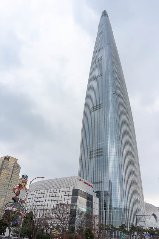 Korea-Seoul-Myeondong-Shopping - The Lotte tower! Its huge and impressive. The way it bulges out and gets skinnier makes it look taller than it is. I believe a few windows fell off an