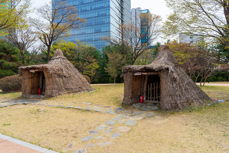 Korea - HK - China - KORKONG! - On my return journey I passed yet another park, this one is a prehistoric park, complete with straw huts with cctv.