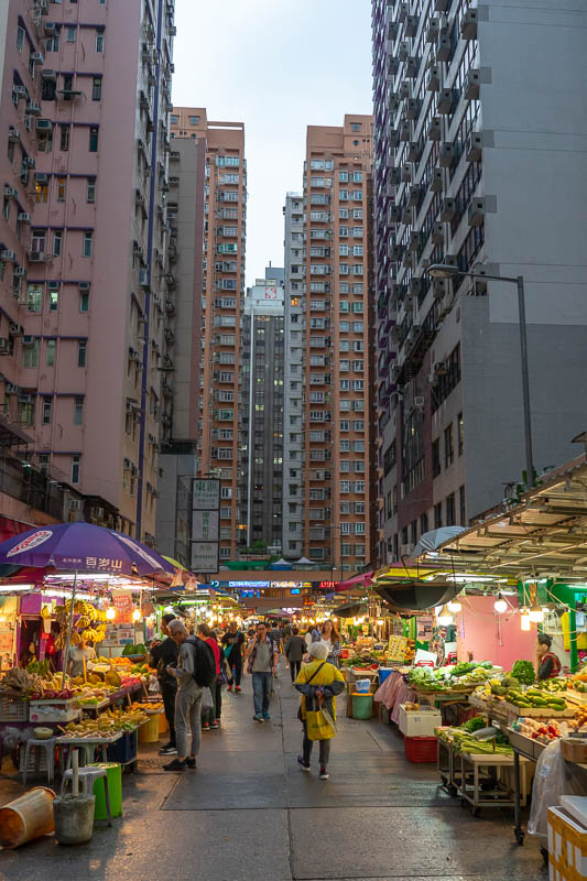 Hong Kong-Mong Kok - Here is a market. The towering apartments make it more interesting. I really dont mind the smell of durian, some people cant stand it. Maybe I just ha