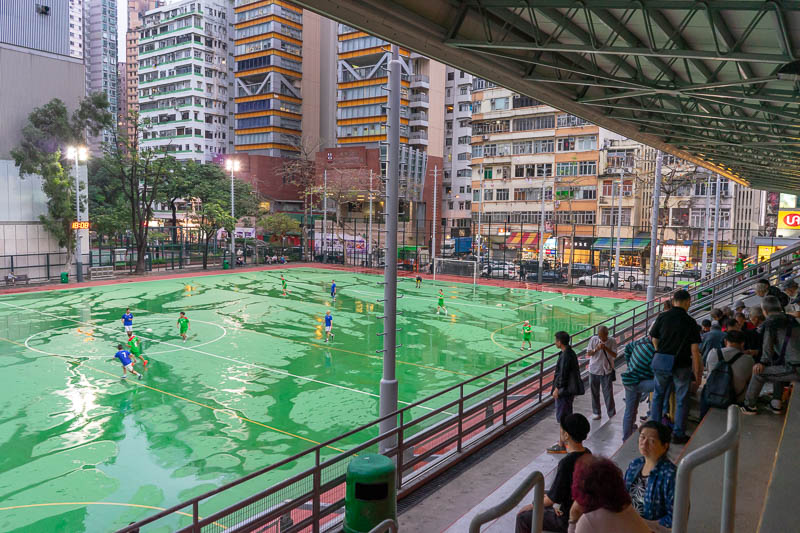 Hong Kong-Mong Kok - I stopped to take in a senior citizens soccer game played on wet concrete under lights. Awesome.