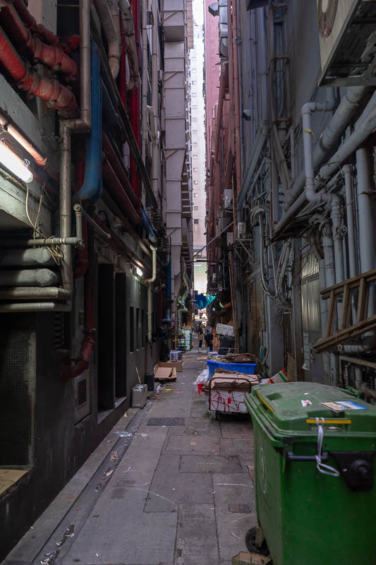 Hong Kong-Mong Kok - Laneways between the buildings are where it all happens, generally chefs smoking.