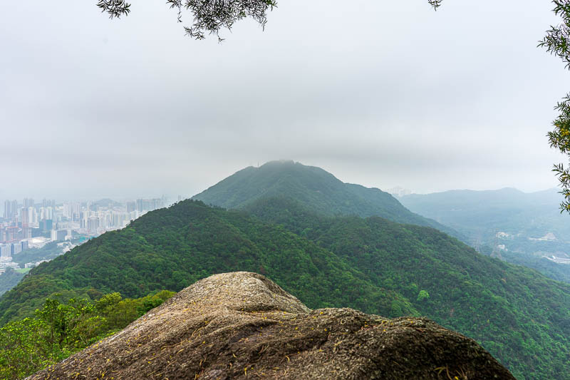 Hong Kong-Hiking-Lion Rock - Half way up the rock part of lion rock looking back at beacon hill. The Beacon has since vanished in the fog.