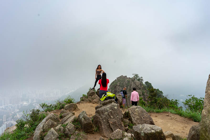Hong Kong-Hiking-Lion Rock - These Filipino girls are trying their best to die posing for photos.