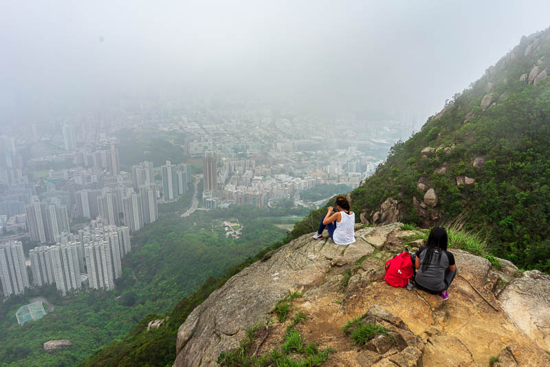 Hong Kong-Hiking-Lion Rock - More Filipinos perched on the edge. I am starting to understand why they need the signs everywhere telling people not to go on the official hiking tra