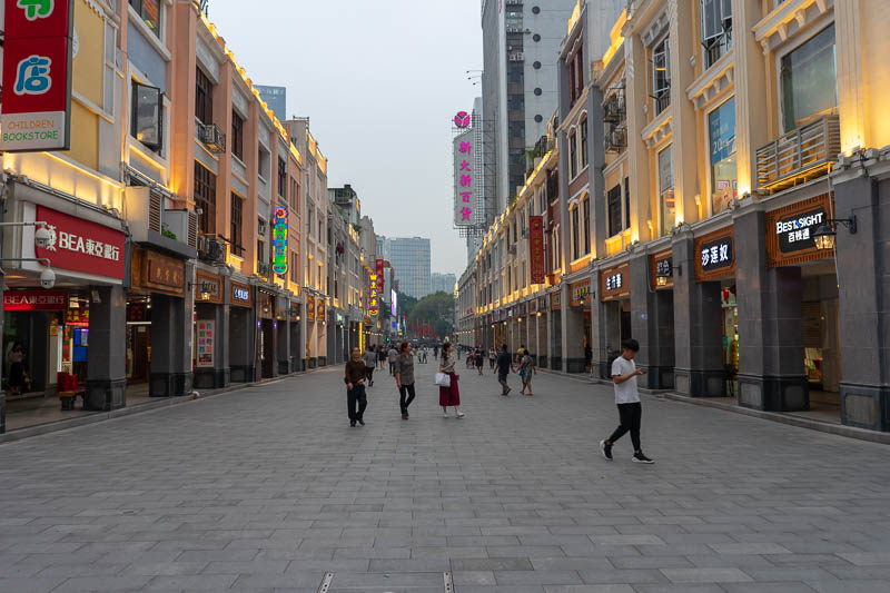 China-Guangzhou-Pasta - This street is the weather gauge. Last night it was used for sun, yesterday morning flood, before that mist. Tonight it is used for hazy sun at dusk.