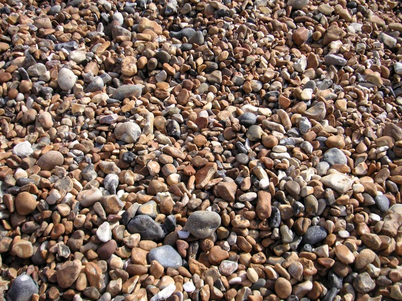 England-Brighton-Jetty-Beach - Welcome to the beach, stretch out and relax on a sea of rocks.