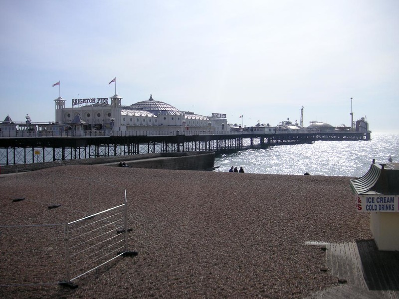 England-Brighton-Jetty-Beach - More of the pier, it has 2 roller coasters on it, and 2 'casinos', but not real casinos, just cheap slot machines.