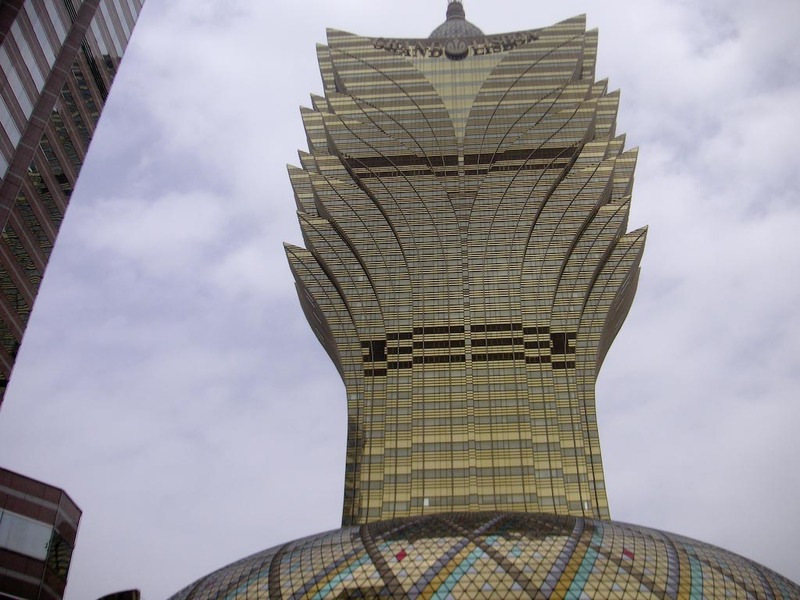 Macau-Casino-Ferry-Custard Tart - The terrifying Lotus flower casino building, looks to me like it could topple at any time.