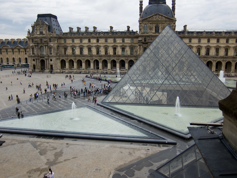 France-Paris-Museum-Louvre - The massive courtyard with the new pyramid underground entry that ties the 3 areas of the museum together.