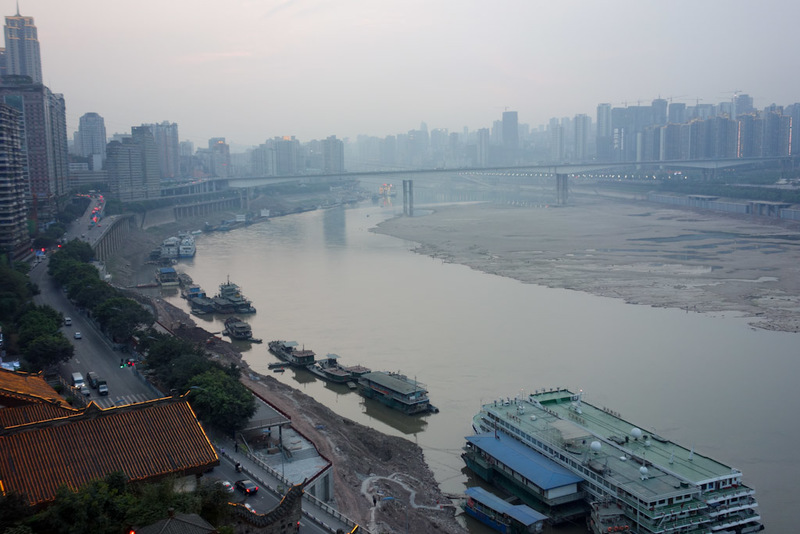 China-Chongqing-Jiefangbei-Architecture - Looking up river, you can see another bridge, and a sea of skyscrapers, and a lot of sand where a river should be.