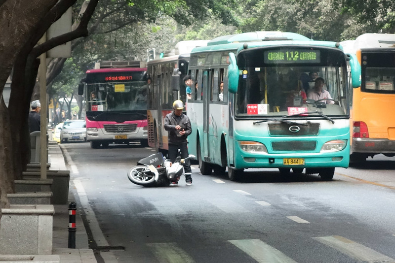 China-Chongqing-Eling Park-Fog - Bus vs motorcycle. Bus Wins! The number of accidents is still high in Chongqing even though scooters are banned. However for every accident I see, I n