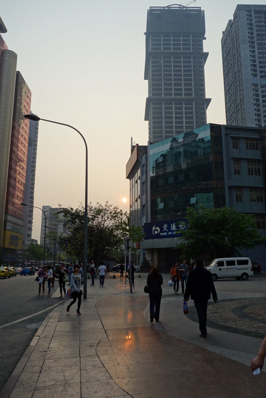 China-Chongqing-Nanping-Starlight Plaza - Staring directly into the moon, no wait its the sun. Its hard to tell. With all the smog the sun is no brighter than the moon. If you looked into the 