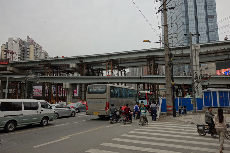 China-Chengdu-Mall-Shopping Street - One of the above mentioned ring roads. It boggles my mind to think that you can walk under it whilst its being built, as I did. You get showered in sp