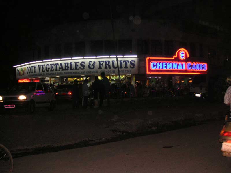 India-Chennai-Traffic - The cake shop on the right is very popular, but everything is made from ghee, which is butter that is fried, and condensed and made more buttery, the 