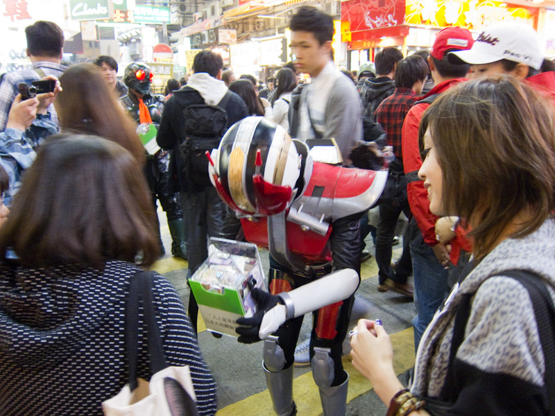 Hong Kong-Market-Mong Kok - Voltron / Power Rangers were busy collecting money for I have no idea what. Chinese only characters on their box prevented a donation from me. For all
