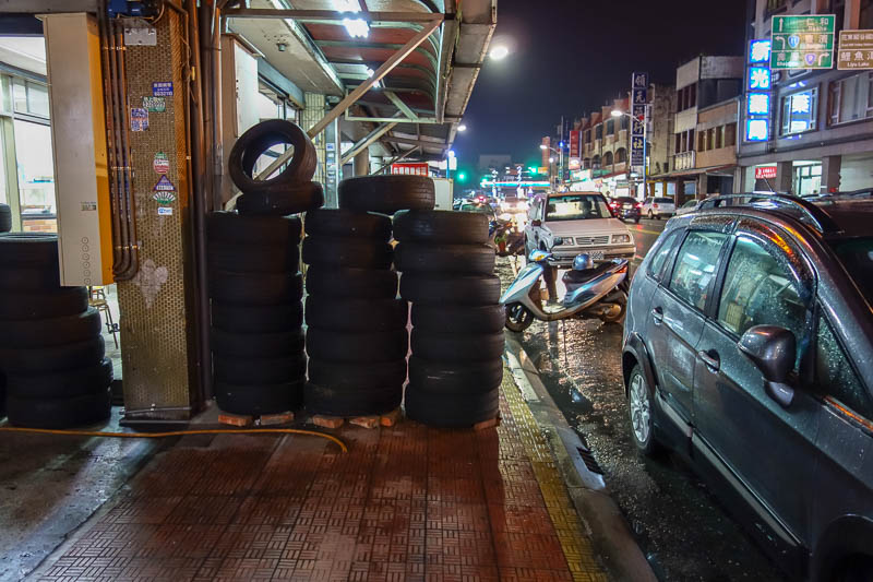Taiwan-Hualien-Food-Dumplings - Final footpath challenge, Tyre wall! Please note, this is not even a tyre shop. There is just a wall of tyres between shops for no reason at all!
