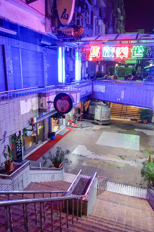 A full lap of Taiwan in March 2017 - Some interesting looking youths in black clothes with hair like peacocks went down these stairs and into the apple bar, which was busy playing Linkin 
