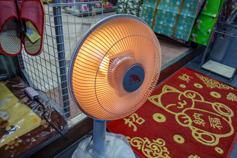 Taiwan-Taipei-Taipei 101-Food-Bibimbap - Taiwanese heater. Stick a heating element in a $5 fan. What could possibly go wrong? Also its about 20C, yet people have winter coats and are sitting 