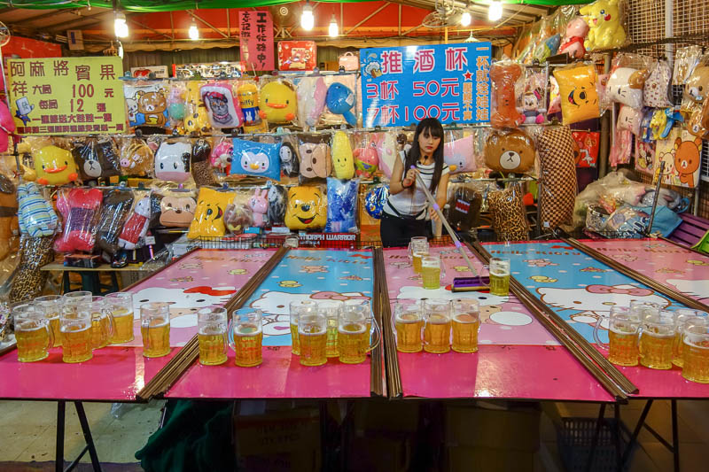 Taiwan-Kaohsiung-Night Market-Ruifeng-Food-Beef - Its a hello kitty drinking game. You pay money to drink x beers in y seconds, and if you win, you get a furry pillow toy.