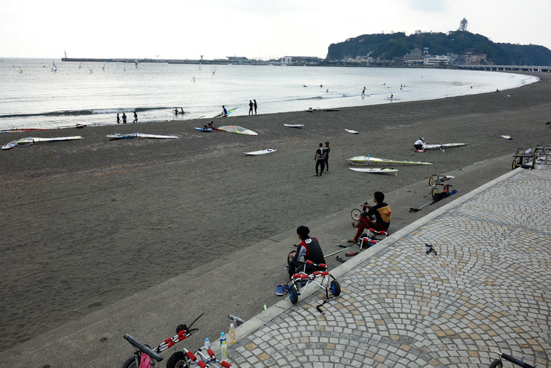 Japan-Kamakura-Beach-Shrine-Enoshima - Back on the mainland, and look at these ridiculous surfers. They all have the gear, but theres no surf at all, yet they sit out there and hope. The wi