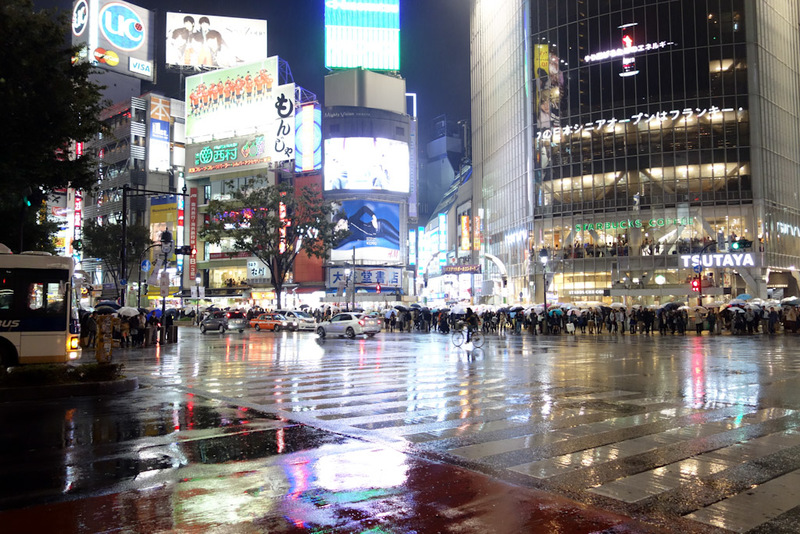 Japan-Tokyo-Shibuya-Rain-Ramen - The Shibuya crossing. I tried to get a vantage point to take a top down shot of 1000 umbrellas but couldnt find a good one. Theres lots of version of 